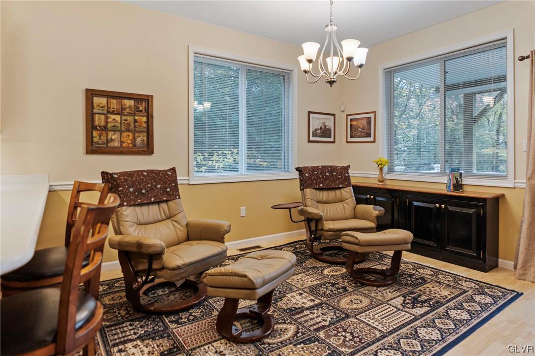 106 Stoney Creek Road Jim Thorpe, PA 18229 - Photo 24 of 50 a living room with furniture a chandelier and a window