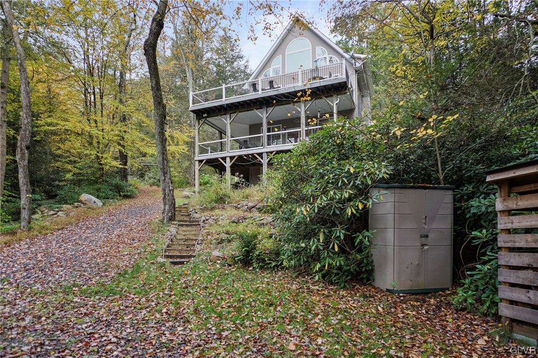 106 Stoney Creek Road Jim Thorpe, PA 18229 - Photo 34 of 50 a view of a house with a yard and large trees