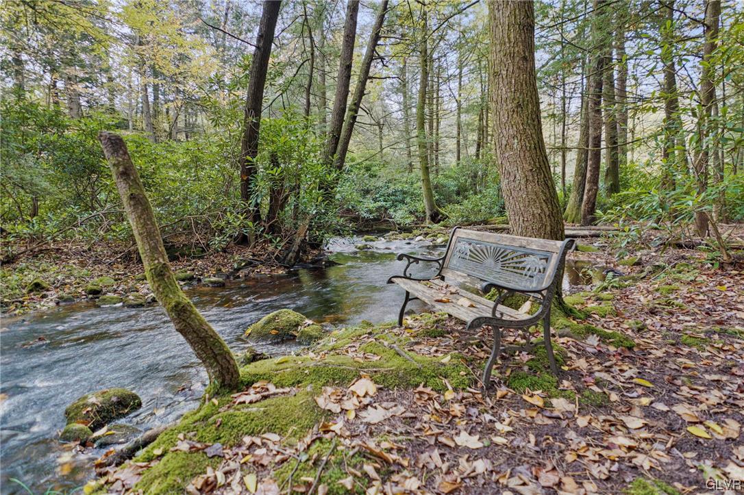 106 Stoney Creek Road Jim Thorpe, PA 18229 - Photo 44 of 50 a backyard of a house with table and chairs
