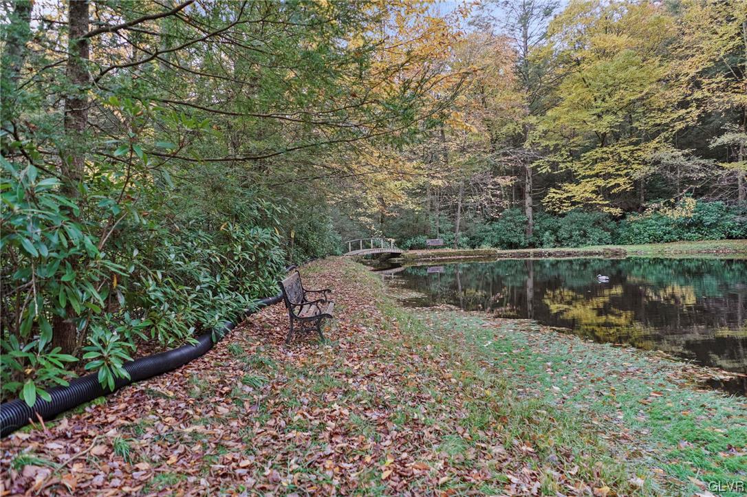 106 Stoney Creek Road Jim Thorpe, PA 18229 - Photo 45 of 50 a backyard of a house with lots of green space and lake view