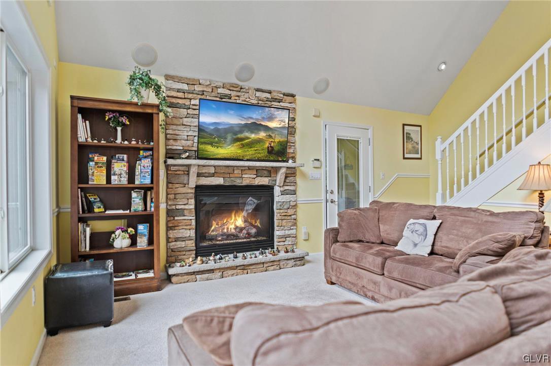 106 Stoney Creek Road Jim Thorpe, PA 18229 - Photo 6 of 50 a living room with furniture a flat screen tv and a fireplace