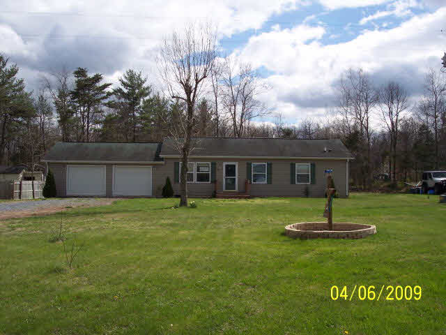 a house view with a garden space