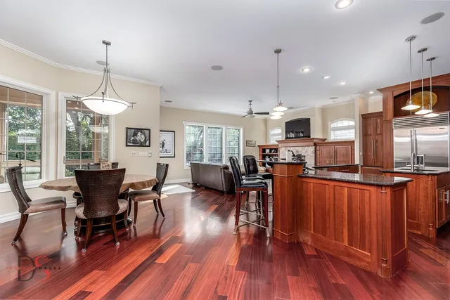 a view of a dining room with furniture window and wooden floor