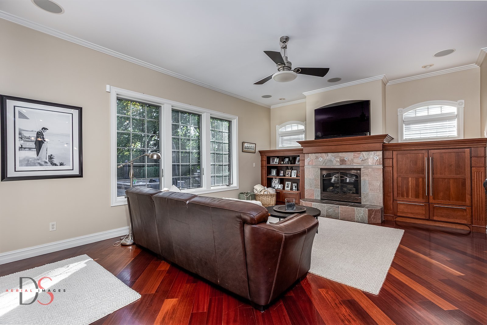 2951 East 1489th Road Ottawa, IL 61350 - Photo 17 of 55 a living room with furniture a flat screen tv and a fireplace