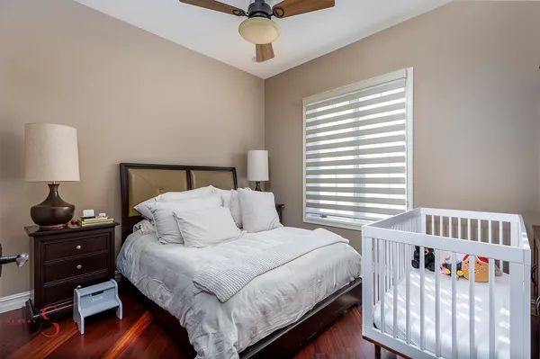 a bathroom with a granite countertop bathtub shower sink vanity and toilet