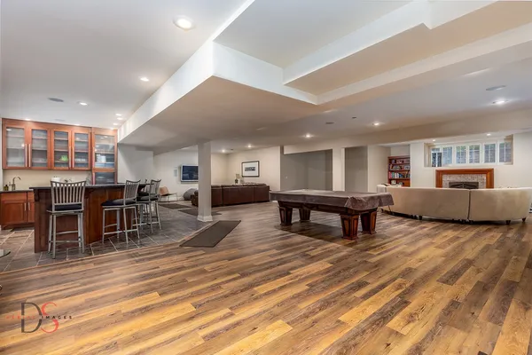 a living room with furniture and kitchen view