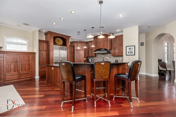 a view of a dining room with furniture and wooden floor