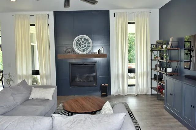 a living room with furniture and a fireplace