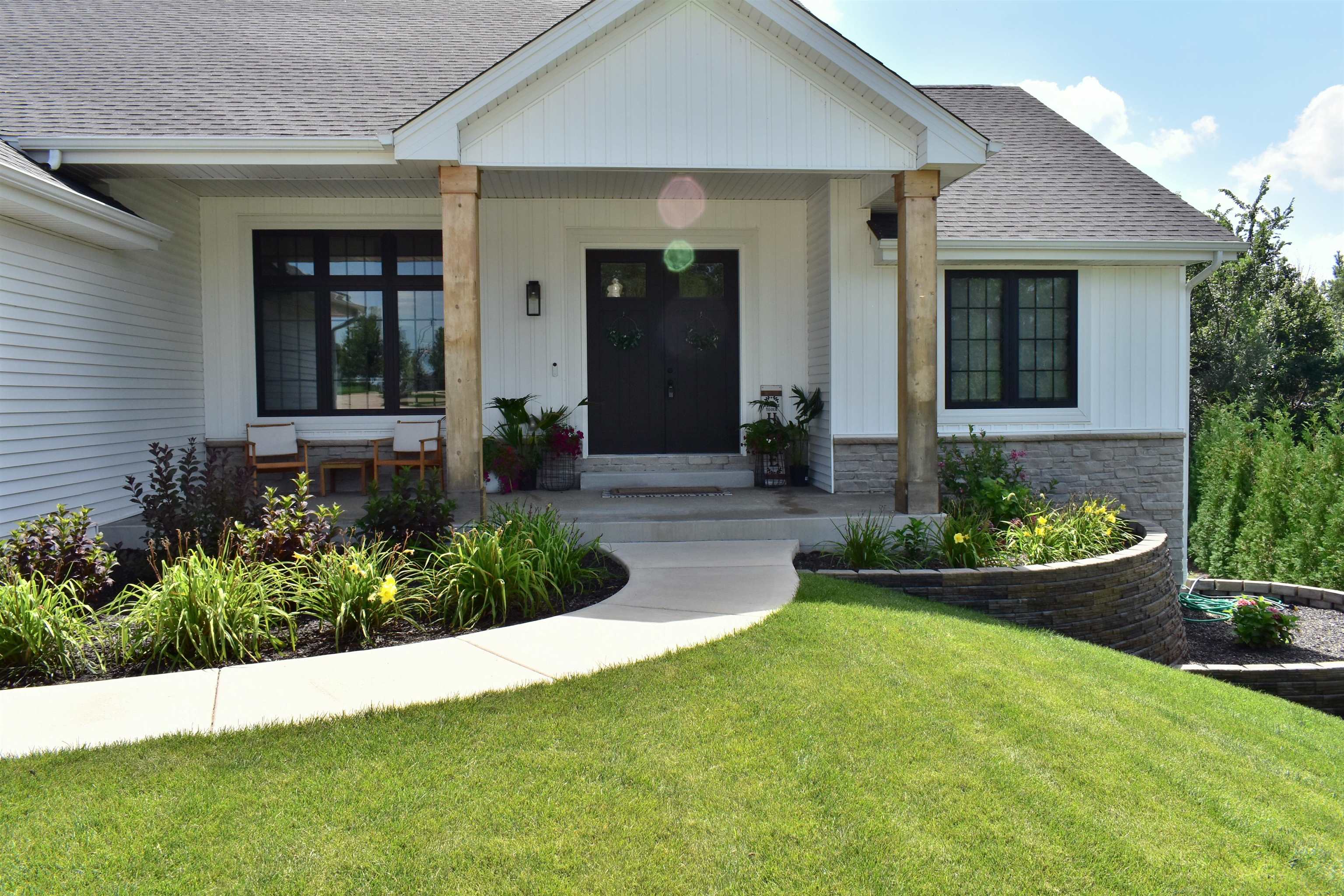 12029 Granite Court Rockton, IL 61072 - Photo 2 of 28 a front view of a house with a yard