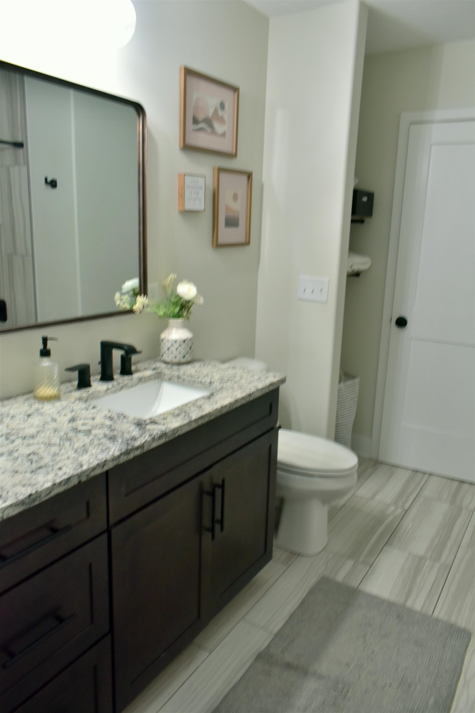 12029 Granite Court Rockton, IL 61072 - Photo 22 of 28 a bathroom with a granite countertop toilet sink and mirror