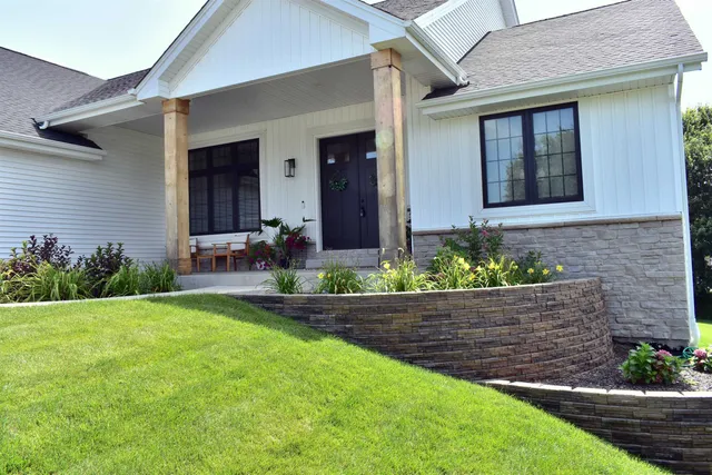 a front view of a house with garden