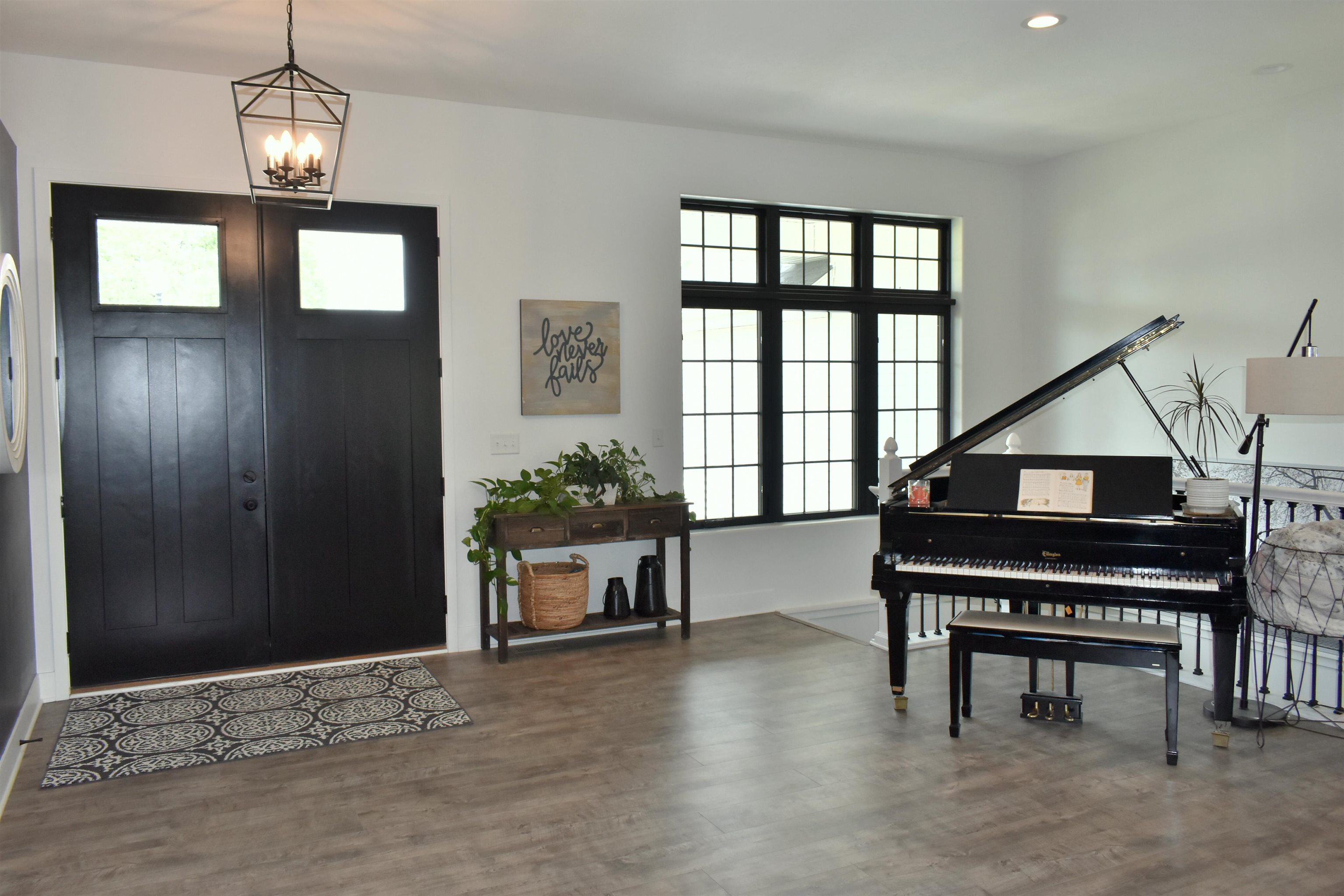 12029 Granite Court Rockton, IL 61072 - Photo 5 of 28 a living room with furniture a piano and a window