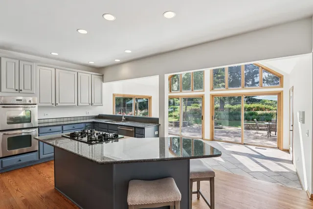 a view of kitchen with sink and window