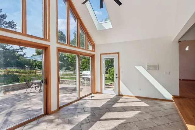 a bathroom with a granite countertop sink a toilet and a mirror