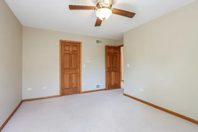 an empty room with fan