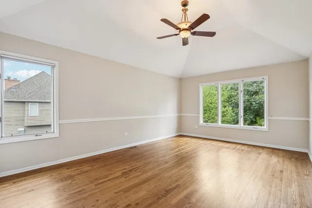 a kitchen with stainless steel appliances granite countertop a sink and a refrigerator
