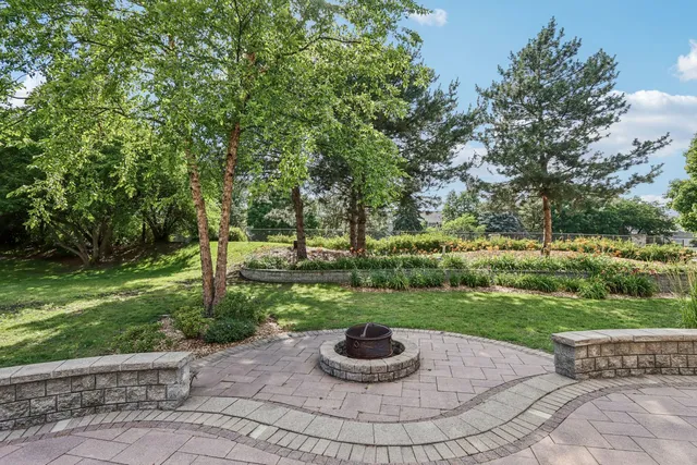an aerial view of a residential houses with outdoor space