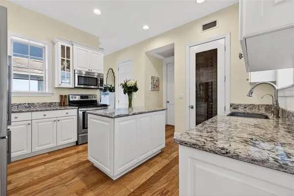an aerial view of residential houses with outdoor space and swimming pool