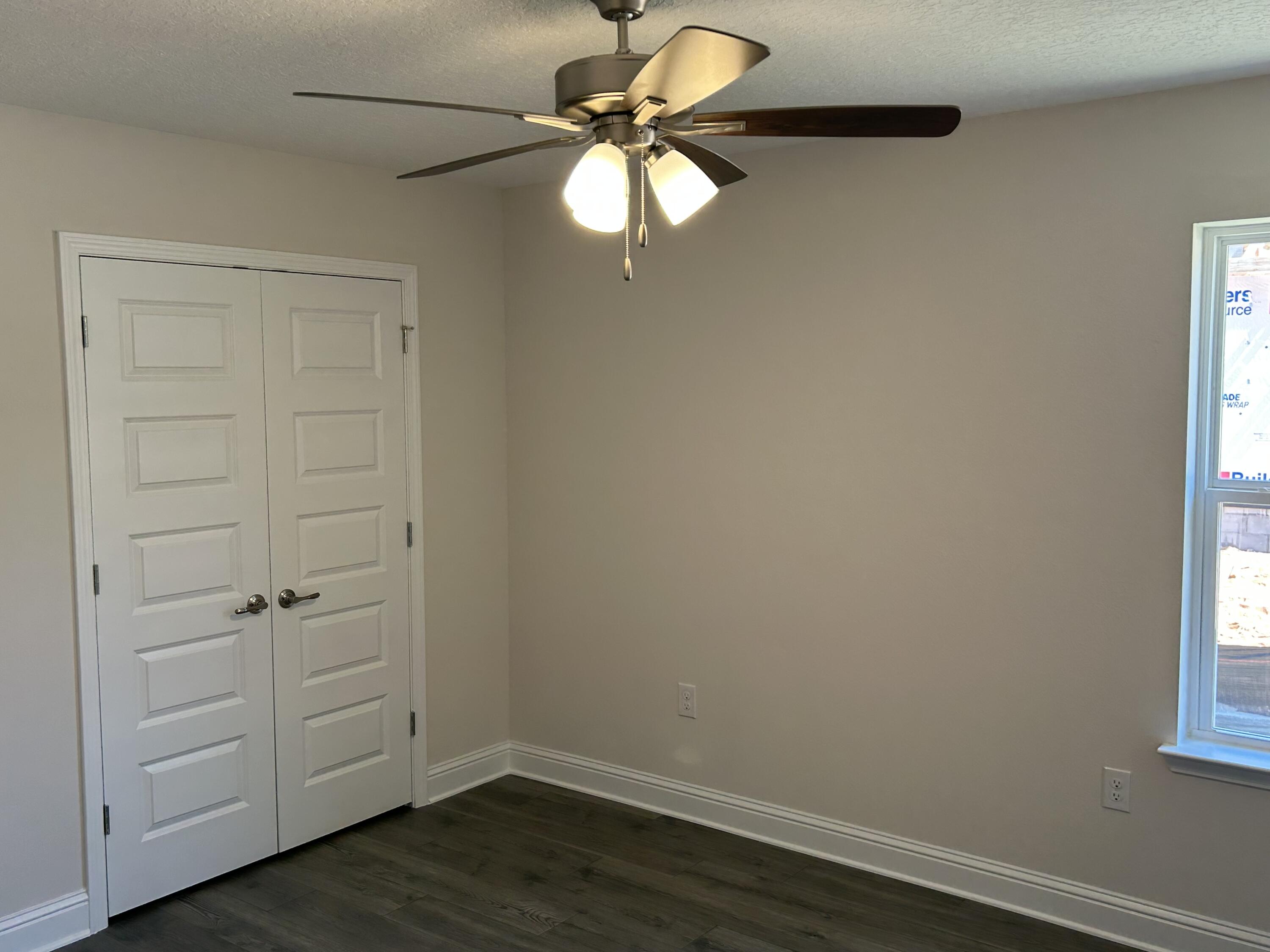 6615 Angle Road, Unit HBTS 5112 Navarre, FL 32566 - Photo 14 of 36 a view of a small space with wooden floor and a window
