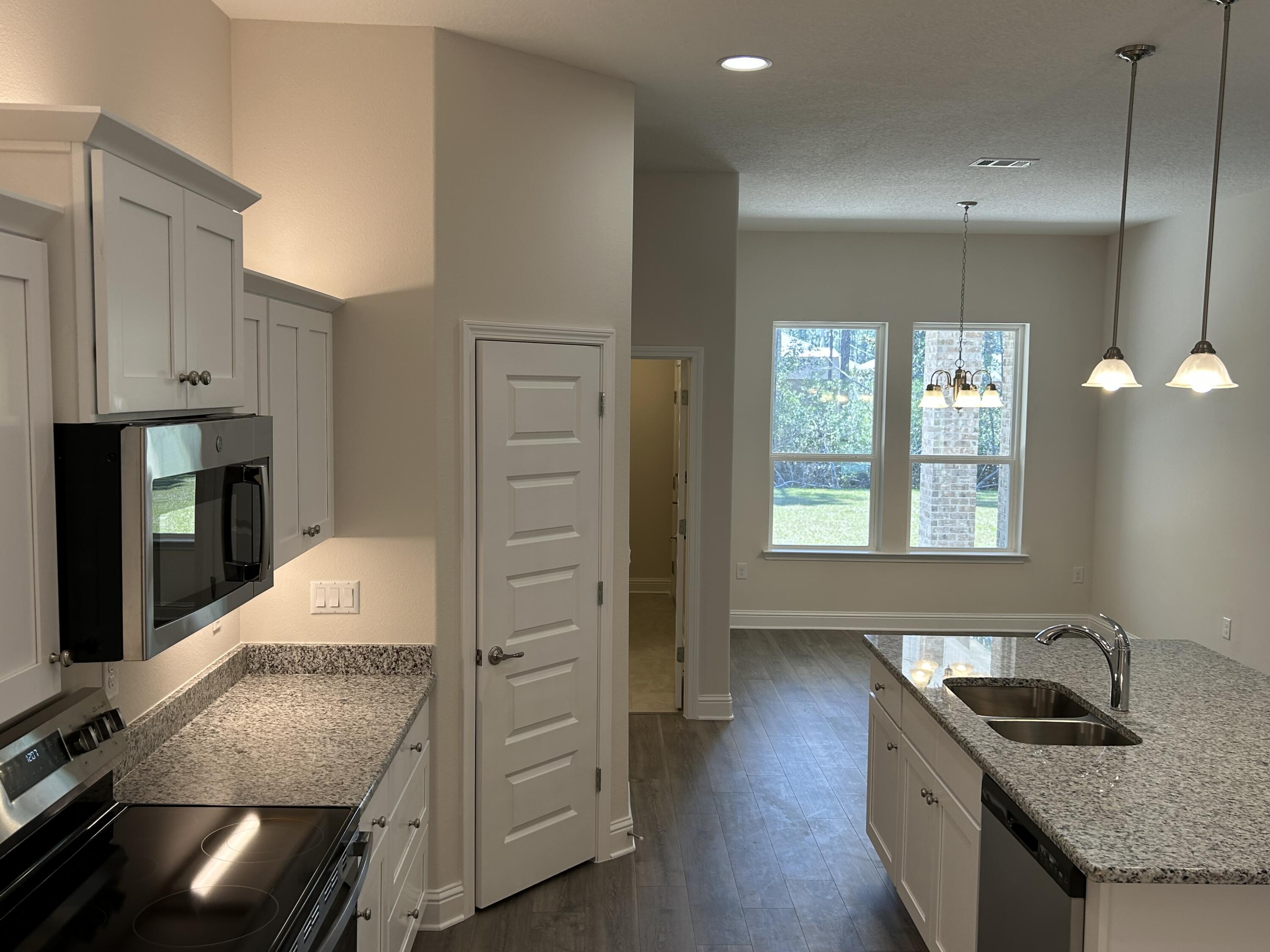 6615 Angle Road, Unit HBTS 5112 Navarre, FL 32566 - Photo 15 of 36 a kitchen with sink and cabinets