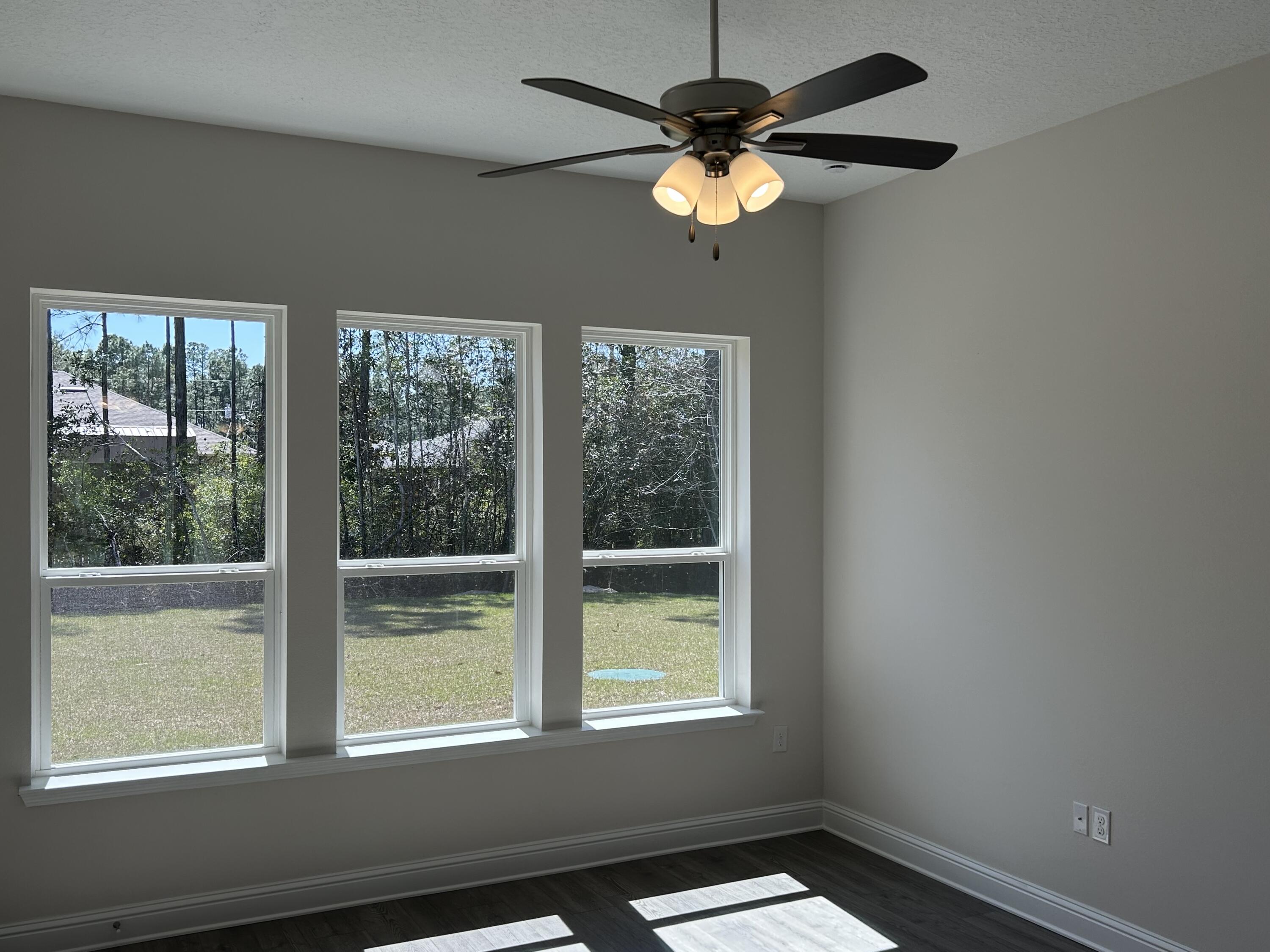 6615 Angle Road, Unit HBTS 5112 Navarre, FL 32566 - Photo 22 of 36 an empty room with windows