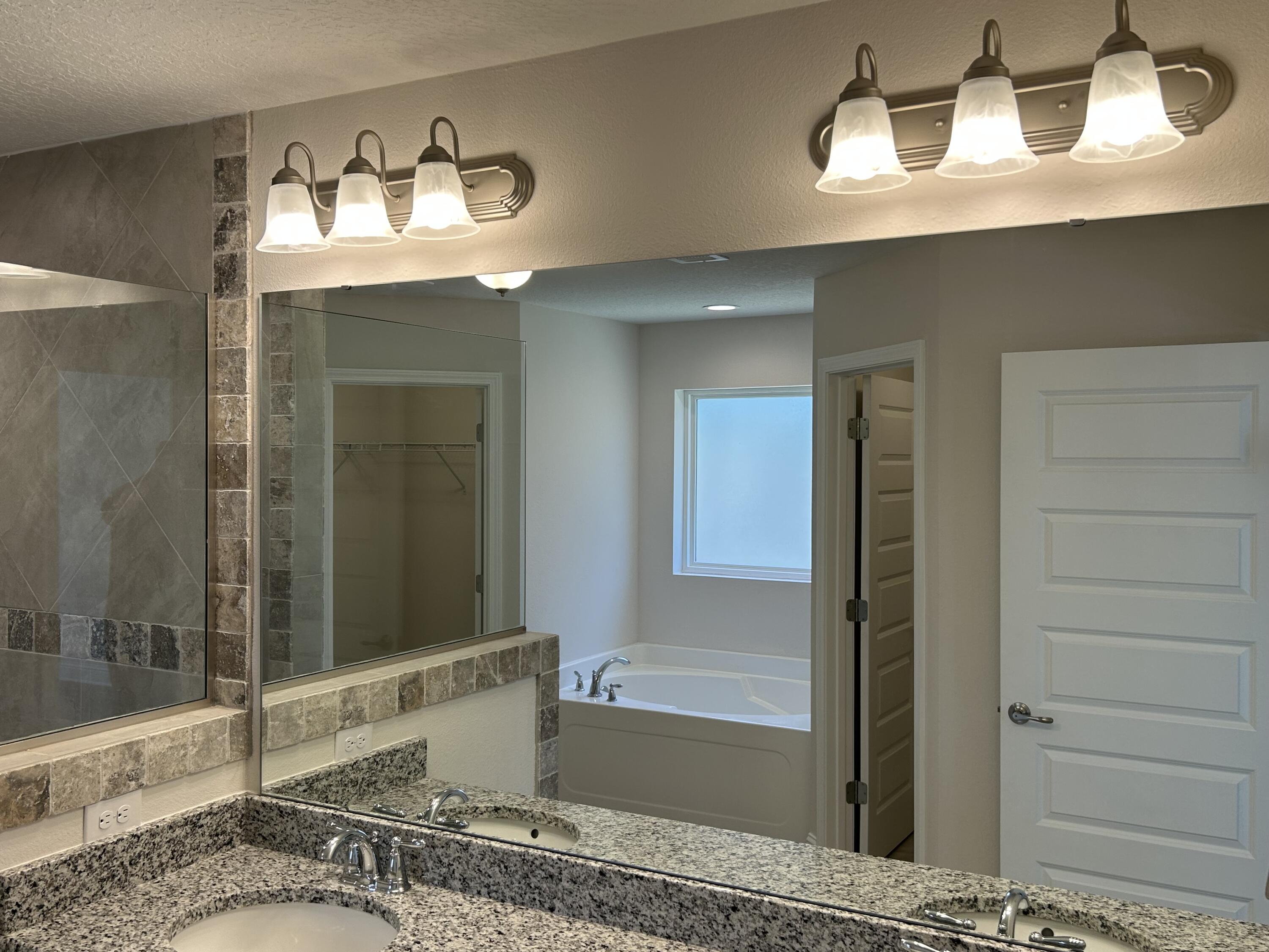 6615 Angle Road, Unit HBTS 5112 Navarre, FL 32566 - Photo 26 of 36 a bathroom with a tub and a sink