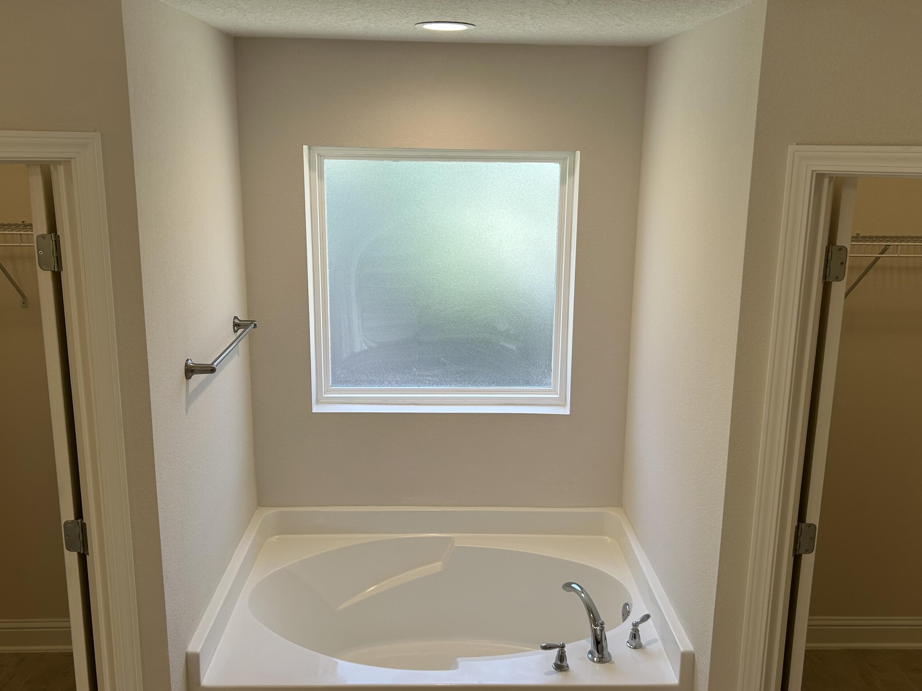 6615 Angle Road, Unit HBTS 5112 Navarre, FL 32566 - Photo 27 of 36 a white bath tub sitting next to a white sink