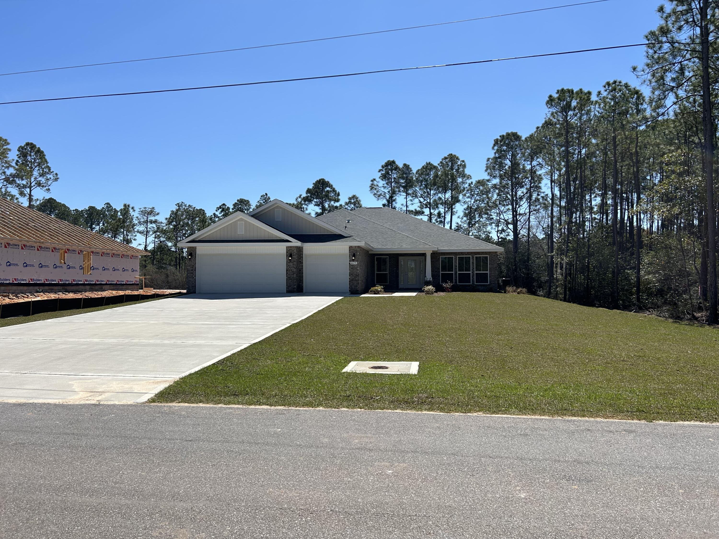 6615 Angle Road, Unit HBTS 5112 Navarre, FL 32566 - Photo 3 of 36 a view of a big house with a big yard