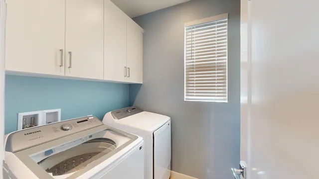 a bathroom with a toilet a sink a mirror and vanity