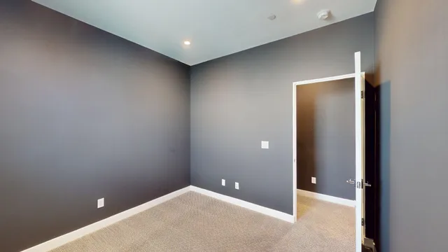 a bathroom with a glass shower door