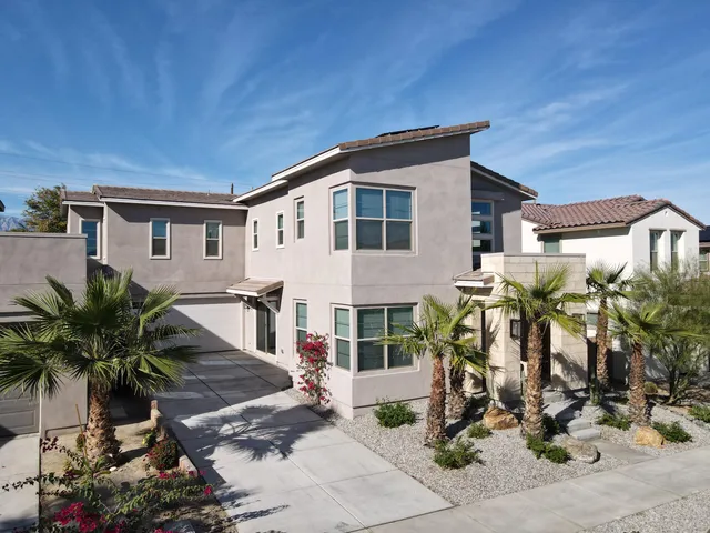 an aerial view of a house with a swimming pool