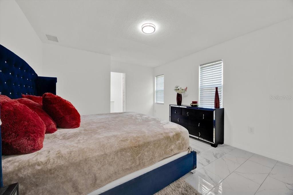 2930 Rio Lane Orlando, FL 32805 - Photo 11 of 28 a bedroom with a bed and a closet