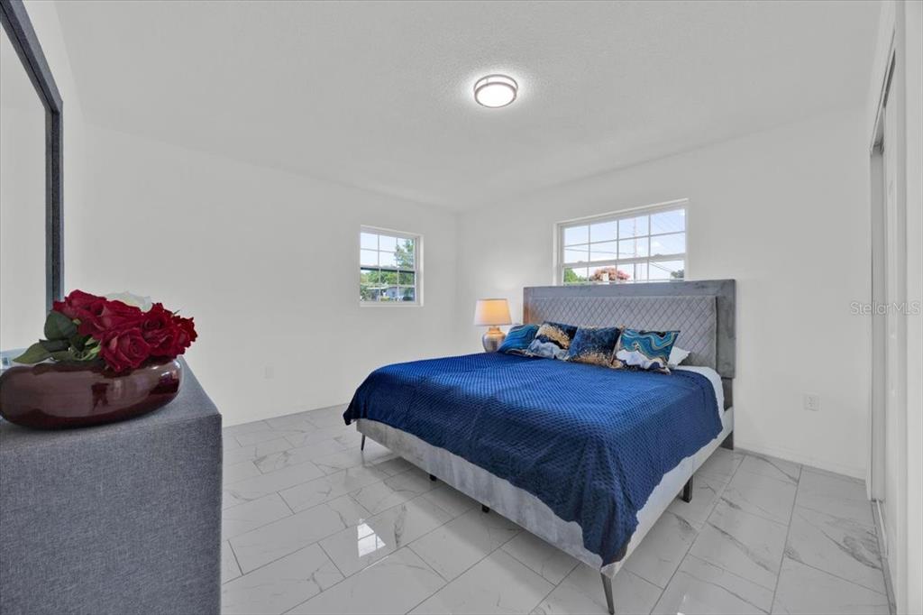 2930 Rio Lane Orlando, FL 32805 - Photo 16 of 28 a bedroom with a bed and a window