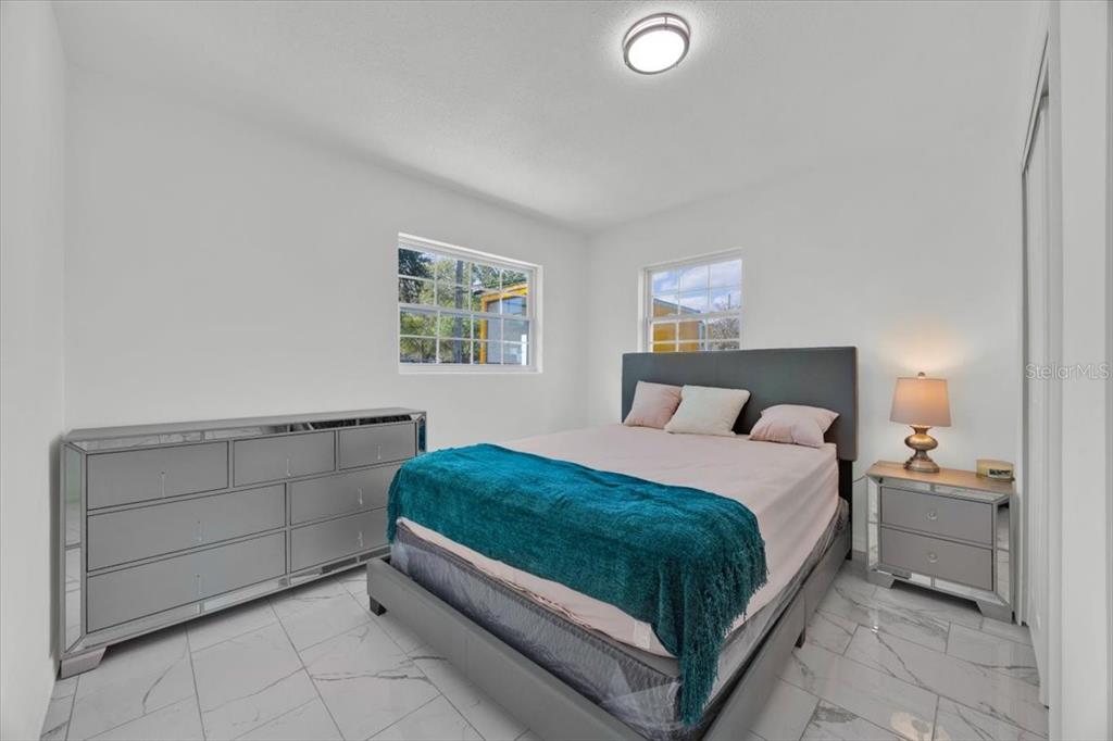 2930 Rio Lane Orlando, FL 32805 - Photo 18 of 28 a bedroom with a bed and window