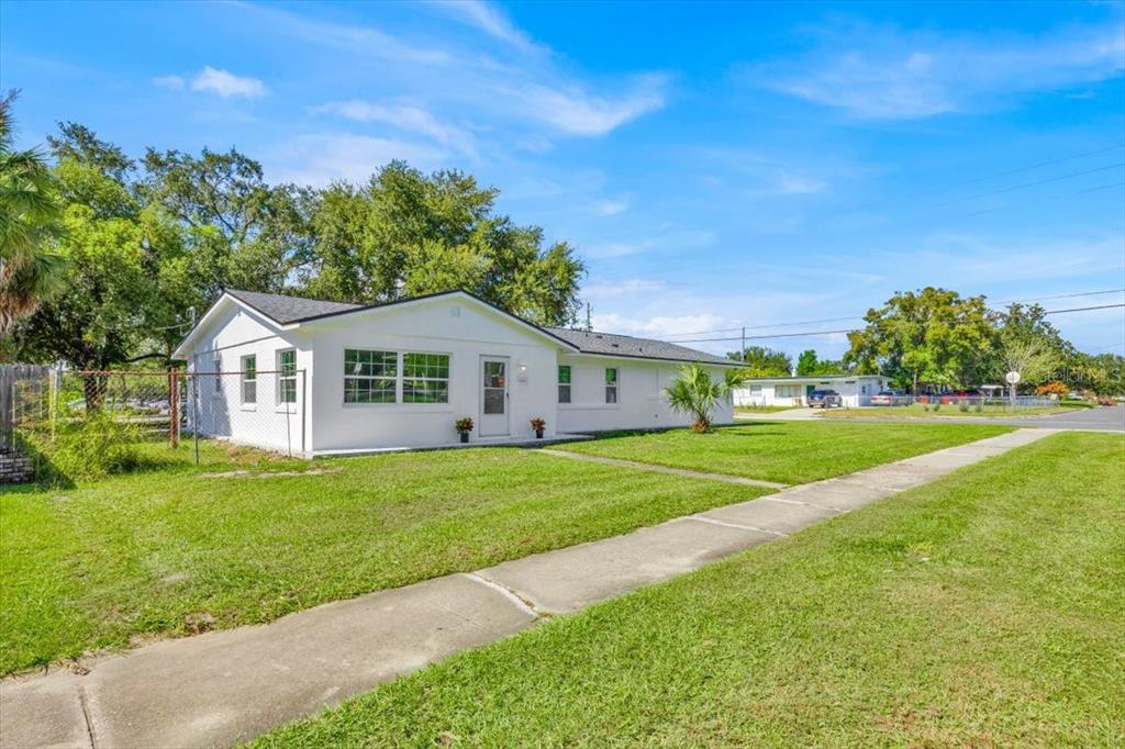 2930 Rio Lane Orlando, FL 32805 - Photo 2 of 28 a front view of a house with garden