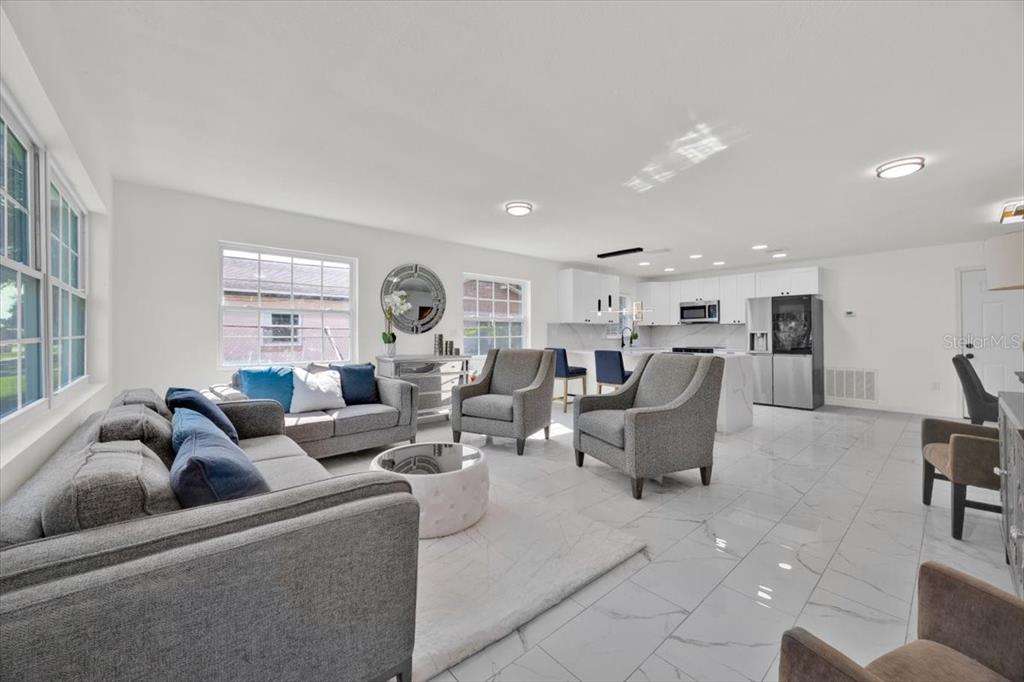 2930 Rio Lane Orlando, FL 32805 - Photo 5 of 28 a living room with furniture and a large window