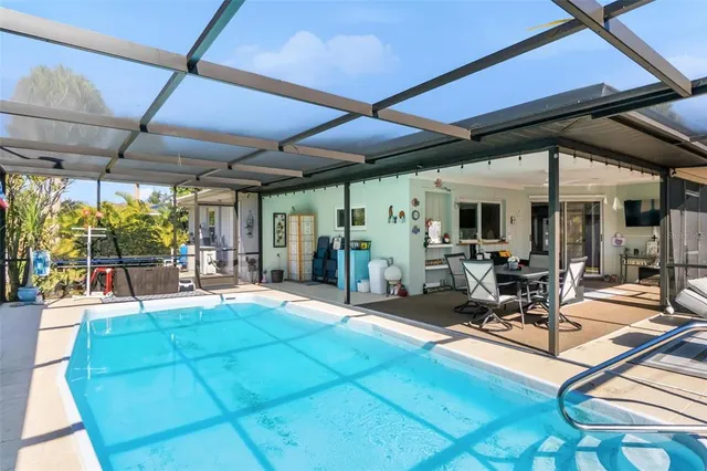 a view of a backyard with chairs