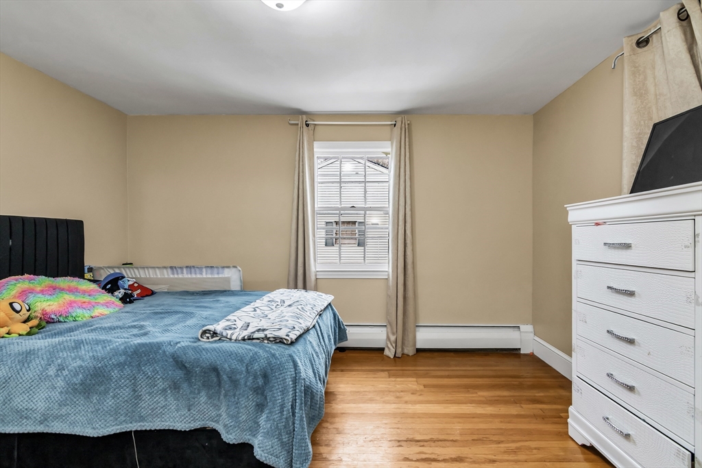 396 Oak Street Methuen, MA 01844 - Photo 14 of 42 a bedroom with a bed and a closet