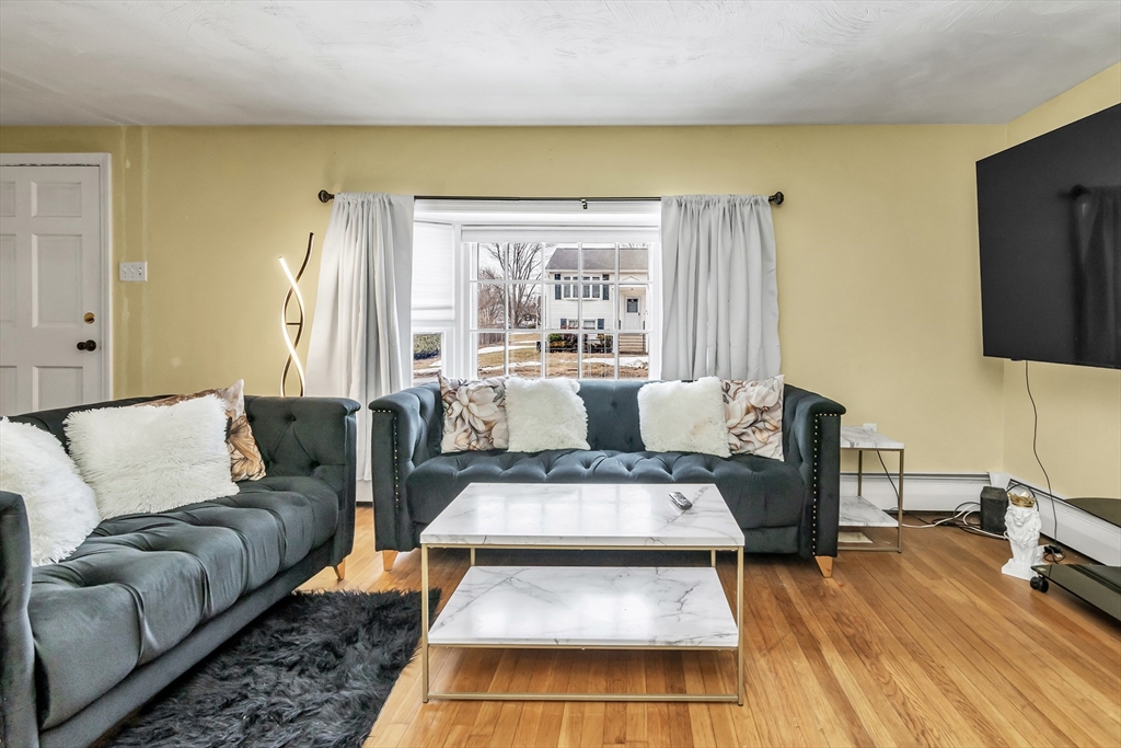 396 Oak Street Methuen, MA 01844 - Photo 20 of 42 a living room with furniture and a flat screen tv