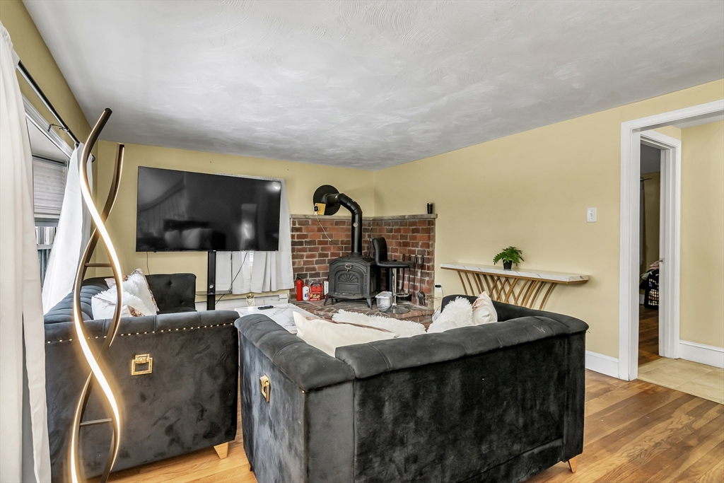 396 Oak Street Methuen, MA 01844 - Photo 21 of 42 a dining room with furniture and a floor to ceiling window