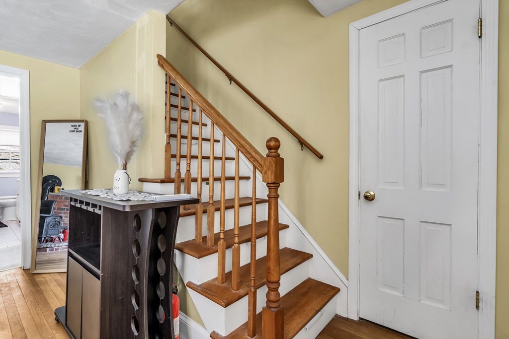 396 Oak Street Methuen, MA 01844 - Photo 22 of 42 a view of an entryway with wooden floor and staircase