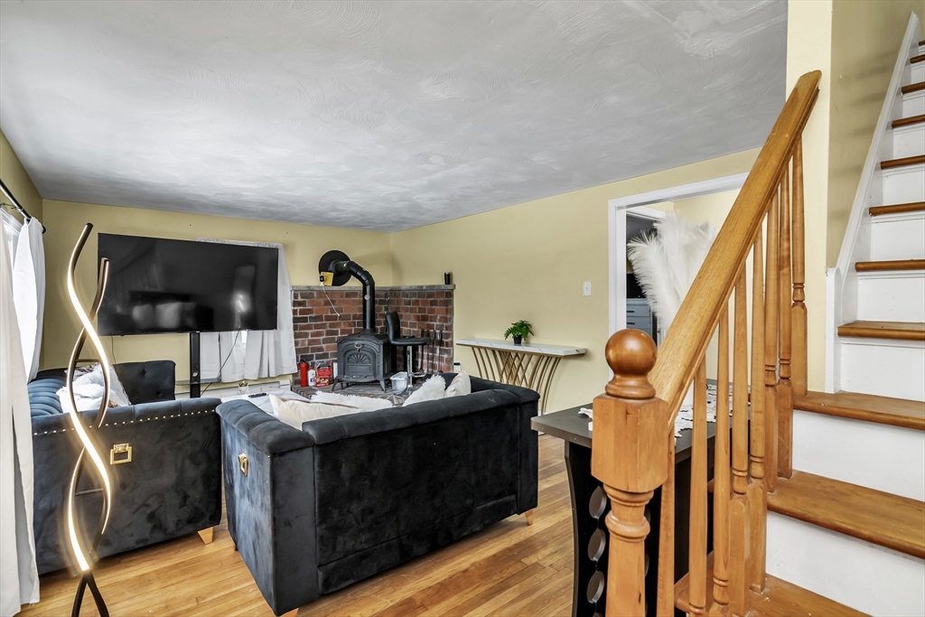 396 Oak Street Methuen, MA 01844 - Photo 23 of 42 a dining room with furniture and wooden floor