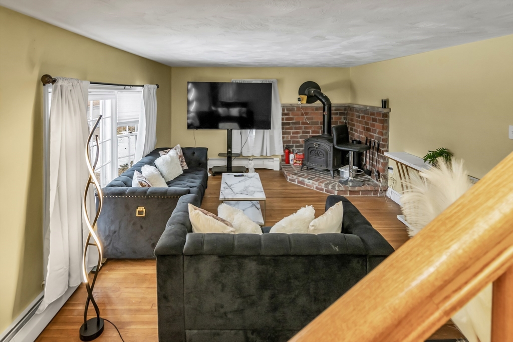 396 Oak Street Methuen, MA 01844 - Photo 24 of 42 a living room with furniture and a flat screen tv