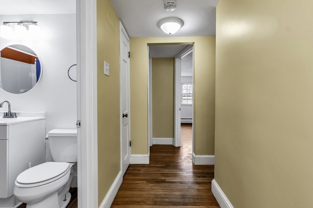 396 Oak Street Methuen, MA 01844 - Photo 28 of 42 a bathroom with a toilet and a mirror