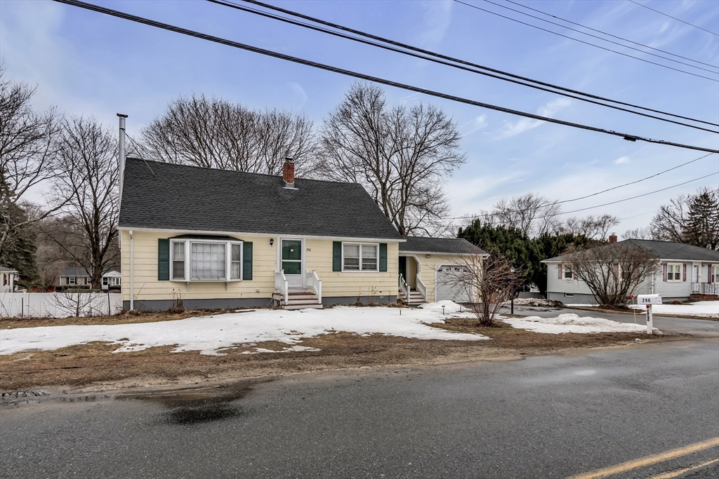 396 Oak Street Methuen, MA 01844 - Photo 3 of 42 a view of a house with a snow on the road