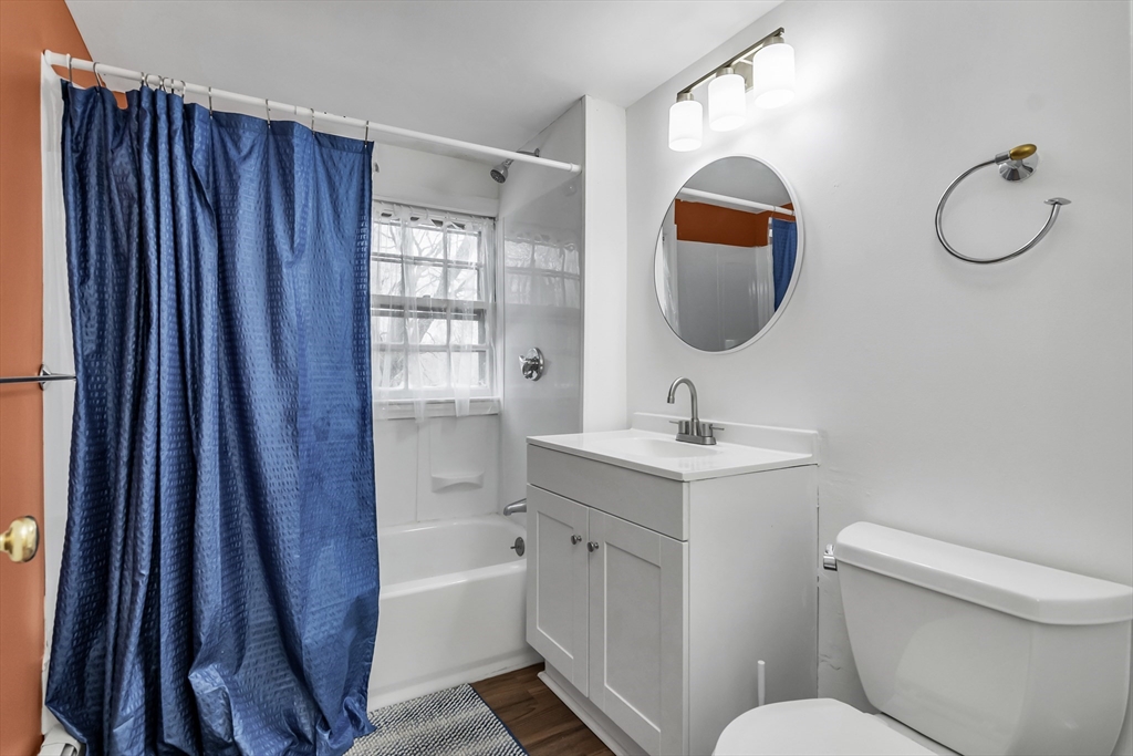 396 Oak Street Methuen, MA 01844 - Photo 31 of 42 a bathroom with a toilet sink and mirror
