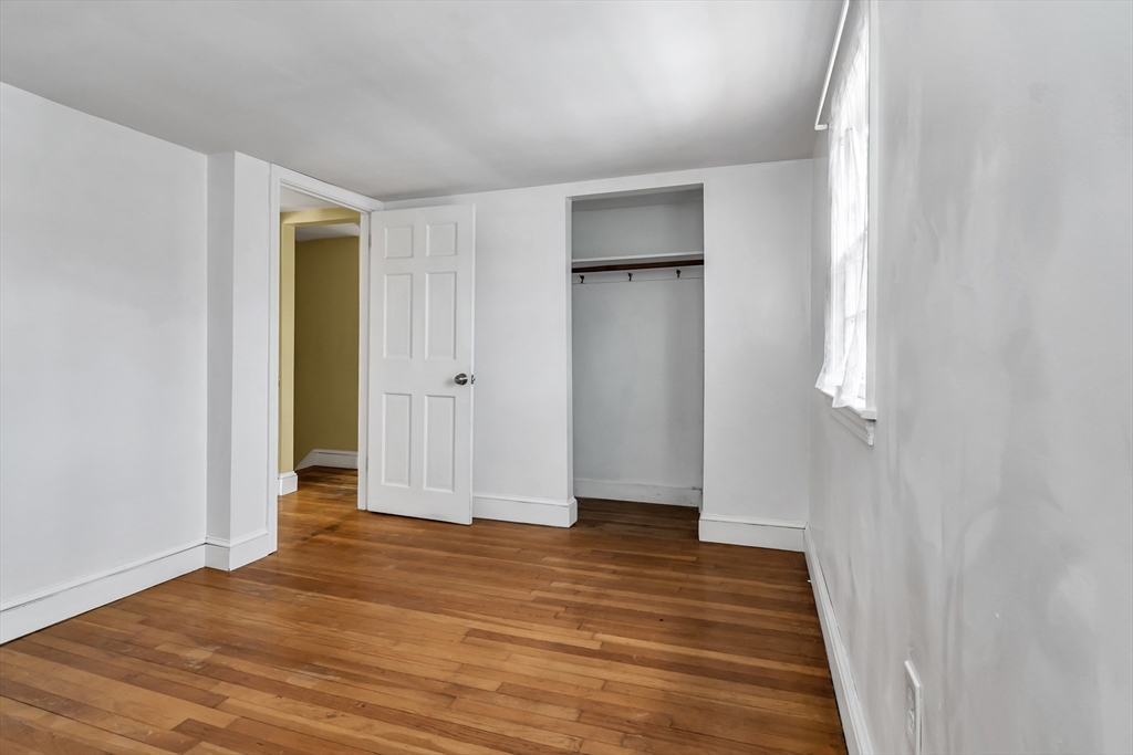 396 Oak Street Methuen, MA 01844 - Photo 37 of 42 a view of empty room with wooden floor