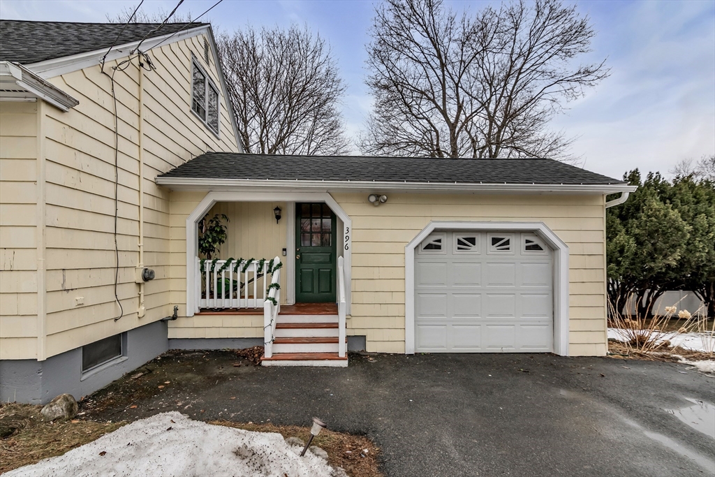 396 Oak Street Methuen, MA 01844 - Photo 4 of 42 a front view of a house with garden