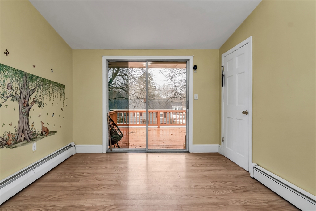 396 Oak Street Methuen, MA 01844 - Photo 6 of 42 a view of a room with wooden floor and door