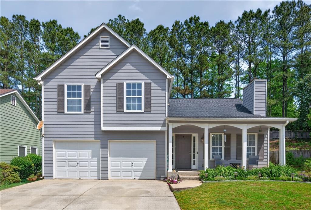 3904 Keystone Ridge Acworth, GA 30101 - Photo 1 of 45 a front view of a house with garden